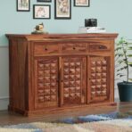 Sheesham wood sideboard cabinet Wooden sideboard with storage Handmade wooden cabinet for dining room Solid wood buffet table Carved wooden storage cabinet Rustic Sheesham wood furniture Wooden cabinet with drawers and doors Natural wood finish sideboard Buy wooden cabinet online Indian wooden furniture for home
